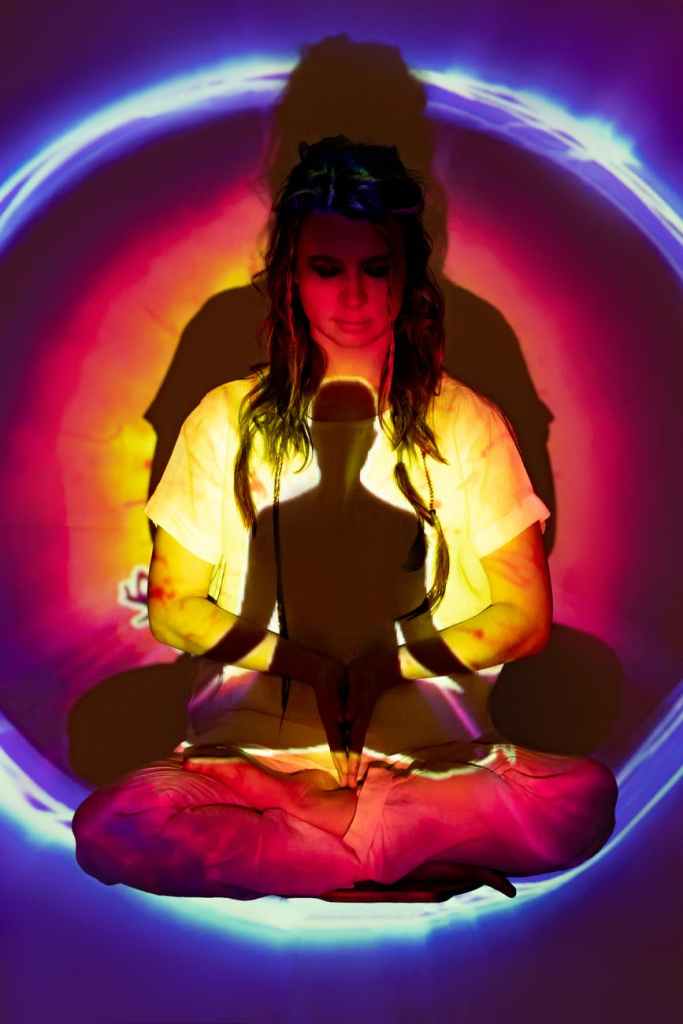 reflection of the spirit within a woman with a field of energy around